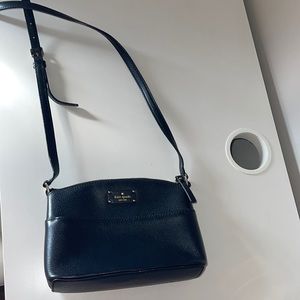 Black Kate spade cross body purse. Clean and in good condition.